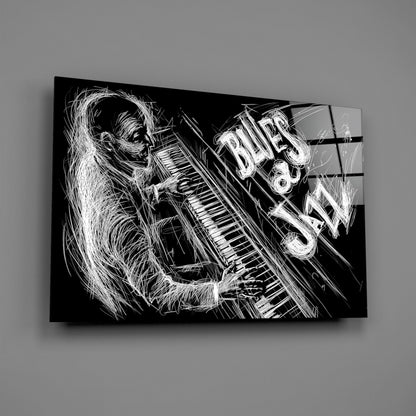 Black and white sketch-style glass wall art depicting a figure playing piano with "BLUES" text, angled perspective view.