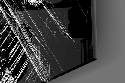 Close-up angled view of glass wall art with white line drawings of musical instruments and abstract jazz-inspired patterns on dark background.