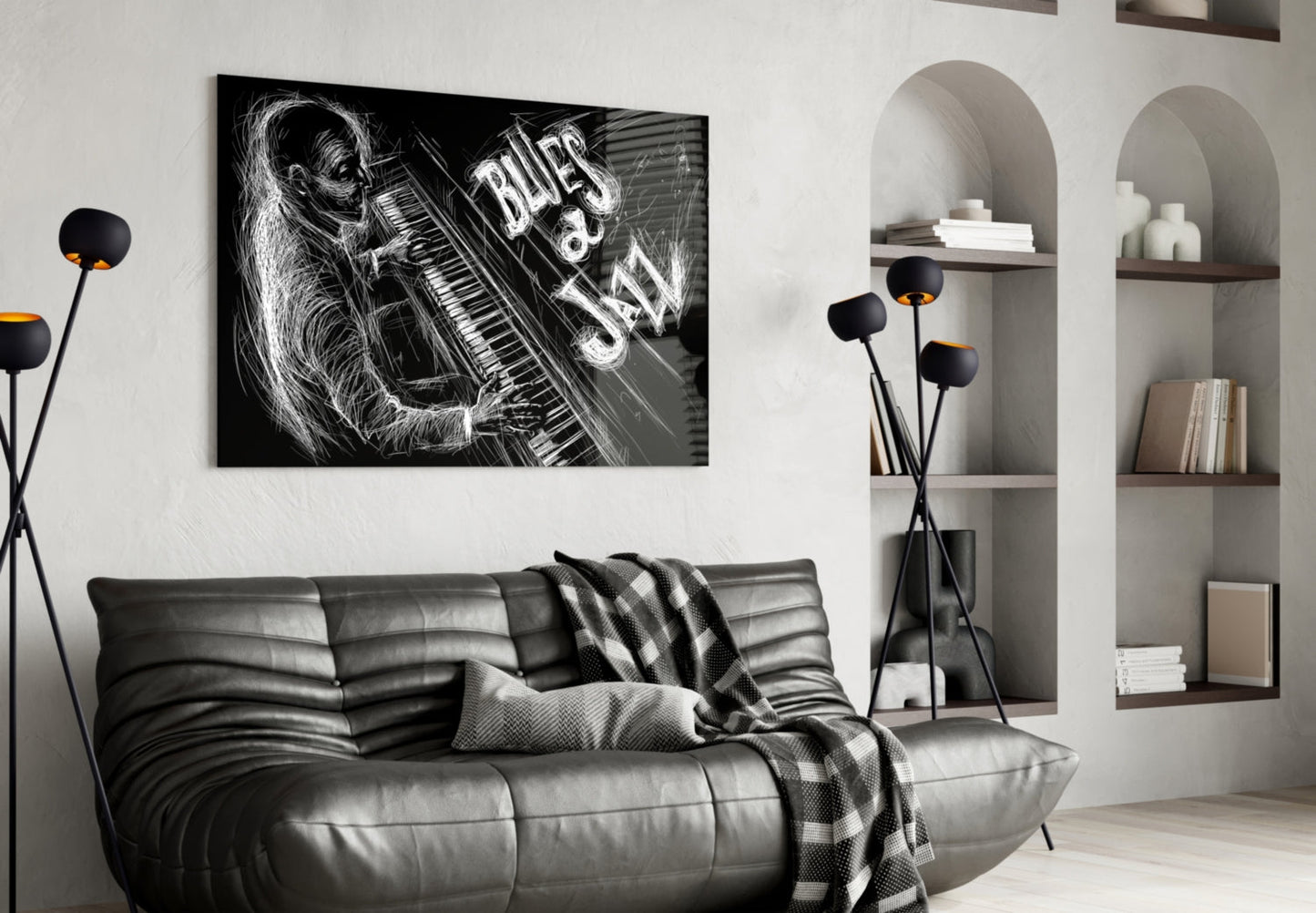 Black and white glass wall art depicting a musician with keyboard and "Blues Jazz" text, displayed above a gray leather sofa in a modern living room.