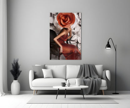 Glass wall art depicting a woman in a red dress with an oversized red rose head, displayed above a white sofa in a modern living room.