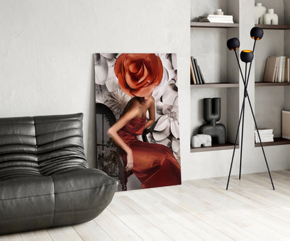 Modern living room interior with glass wall art displaying woman in red dress with oversized red rose, displayed between gray sofa and white shelving unit.