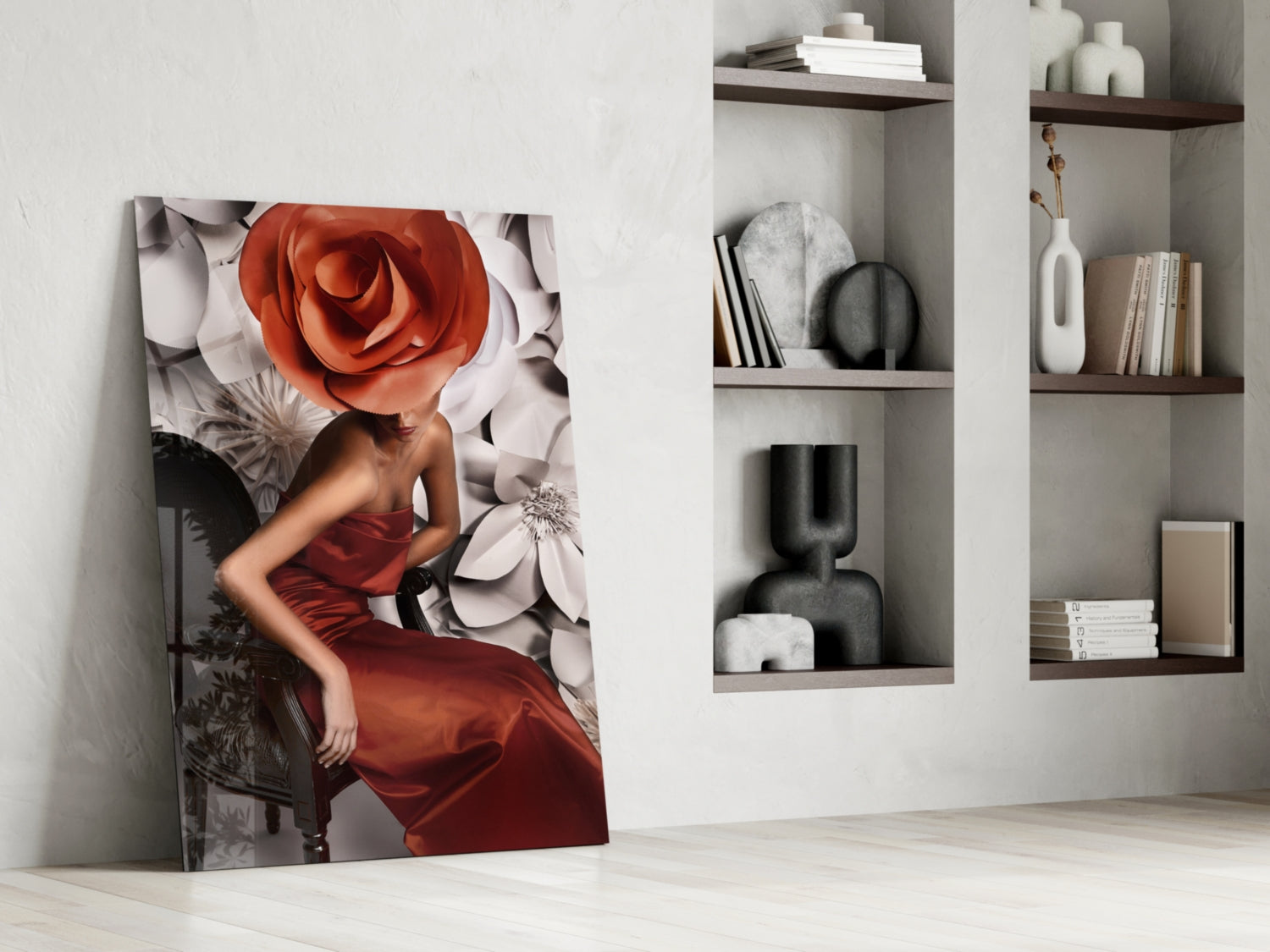 Glass wall art leaning against white wall displays woman in red dress with oversized red and white roses.