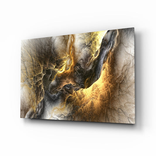 Angled perspective of Golden Chaos Glass Wall Art displaying swirling golden and black abstract patterns with textured surface detail.