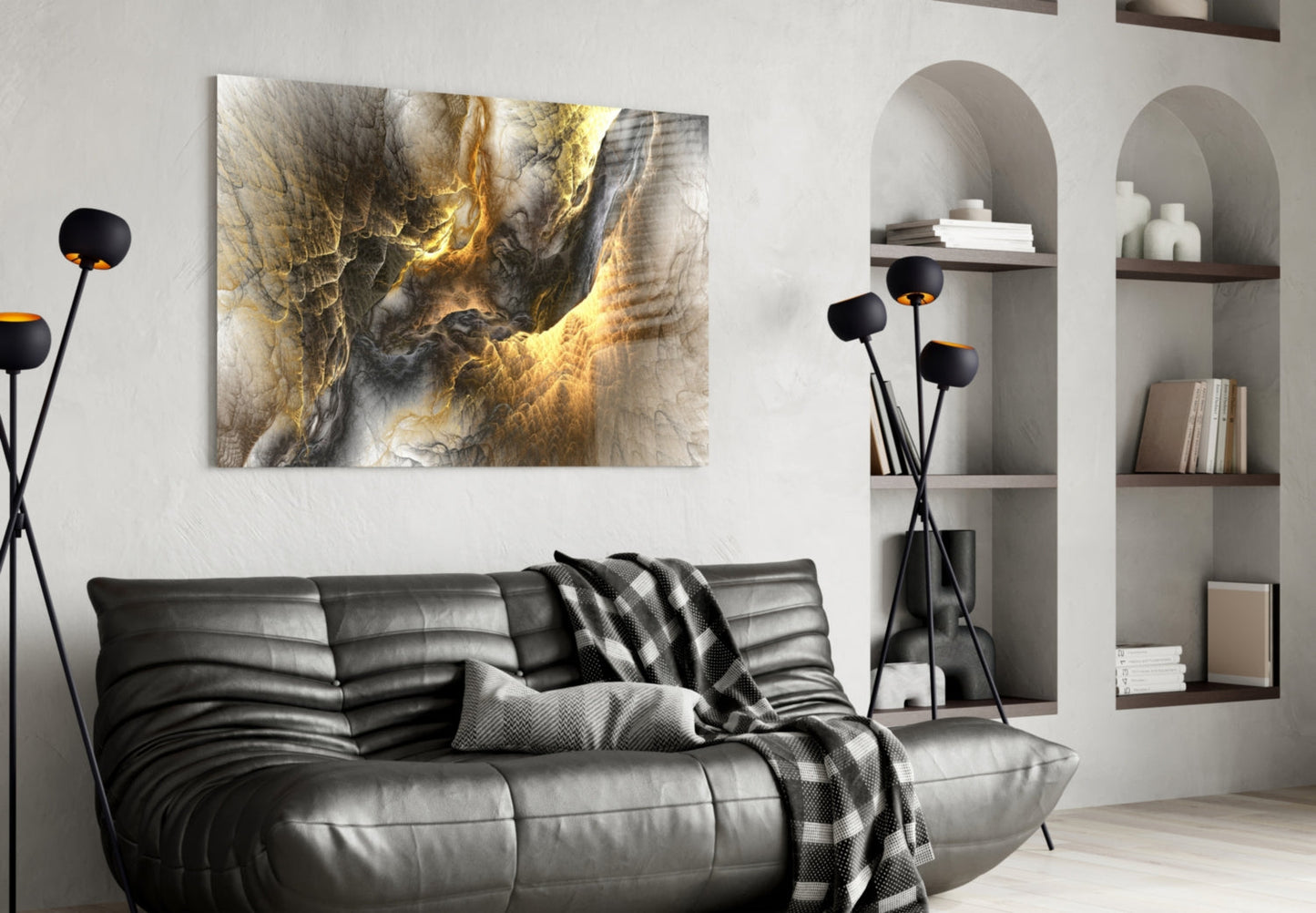 Golden Chaos Glass Wall Art displayed above black leather sofa in modern living room with white shelving.