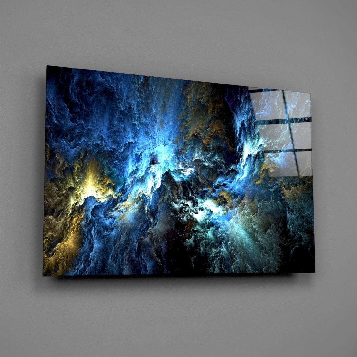 Angled display of tempered glass wall art featuring swirling blue, gold, and white fractal patterns with metallic mounting brackets.