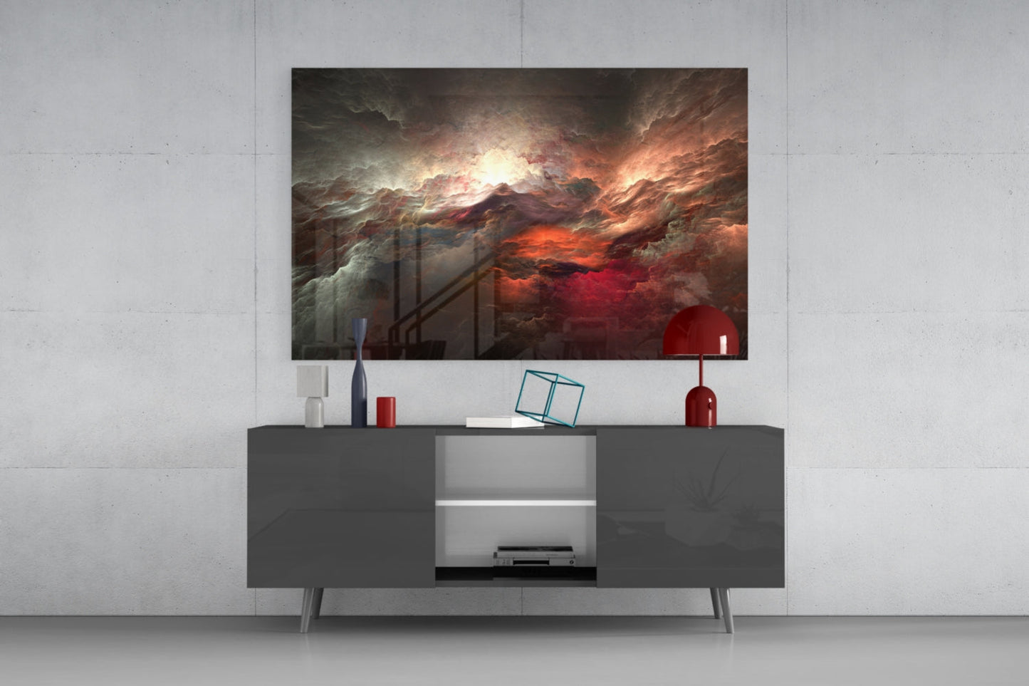 Red Chaos Glass Wall Art displayed above a dark gray media console with red and white decorative accessories in a modern living room setting.