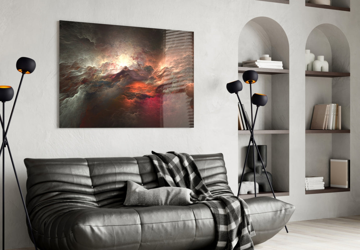 Red Chaos glass wall art depicting dramatic fiery clouds and orange light, displayed above a black leather sofa in a modern living room.
