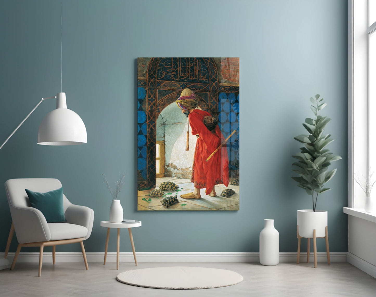 Orientalist painting of a man in red robes with turtles displayed on a teal gallery wall beside modern furniture.