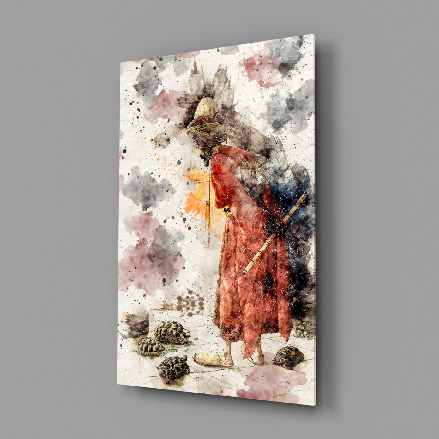 Angled view of glass wall art featuring a watercolor illustration of a figure in red robes with a bird head, surrounded by tortoises and abstract watercolor splashes in gray, pink, and black tones.