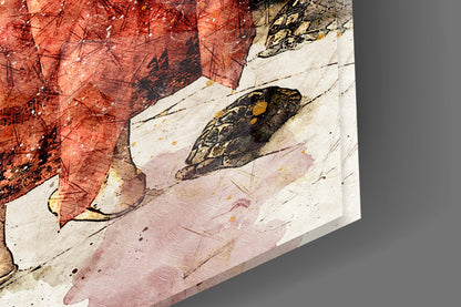 Close-up angled view of glass art showing illustrated tortoise with patterned shell in black and gold against red, pink, and cream watercolor backgrounds.