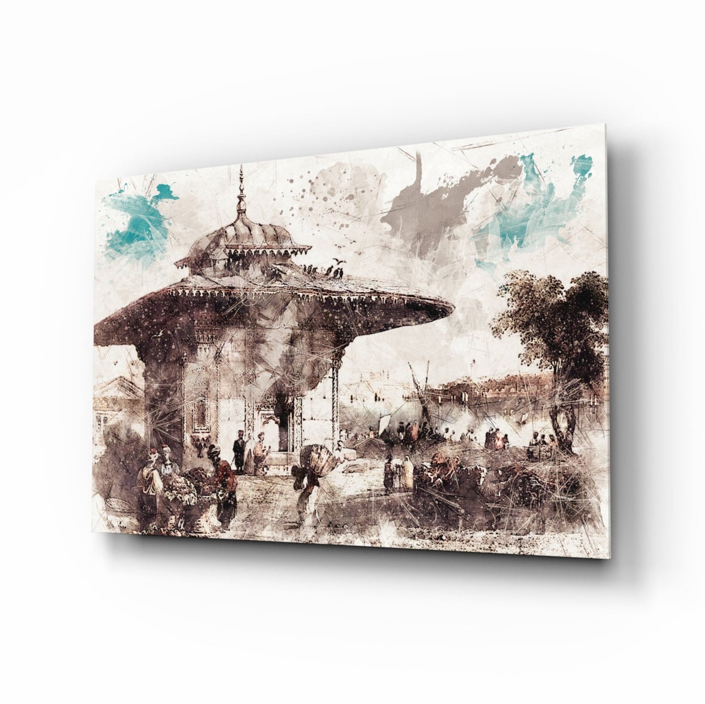 Angled product view of glass wall art depicting a sepia-toned Ottoman architectural scene with a domed fountain structure and crowds, accented with turquoise watercolor splashes.