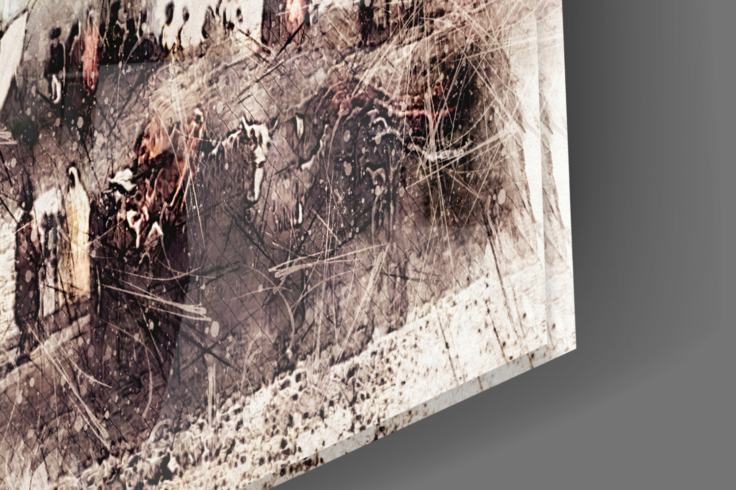 Close-up angled view of glass wall art showing layered abstract design with cream, brown, and gray tones with fine linear details and textured surface.