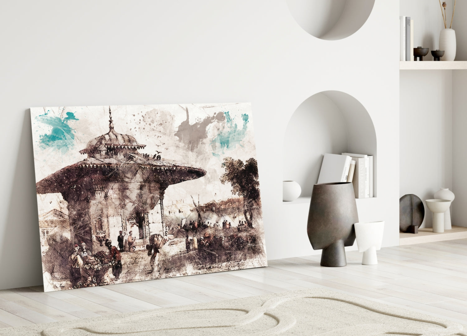 Glass wall art featuring sepia-toned illustration of Ottoman mosque with figures and turquoise watercolor accents, leaning against white wall beside decorative objects.
