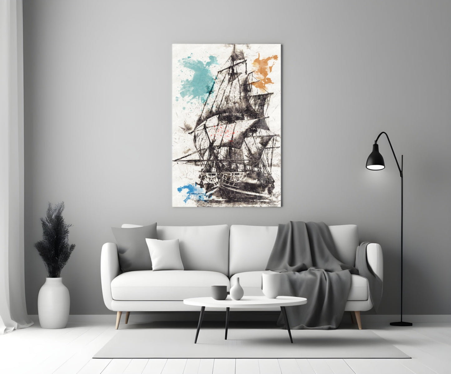 Ship illustration glass wall art displaying a detailed sailing vessel with blue and orange watercolor splashes, hung above a white sofa in a modern living room.