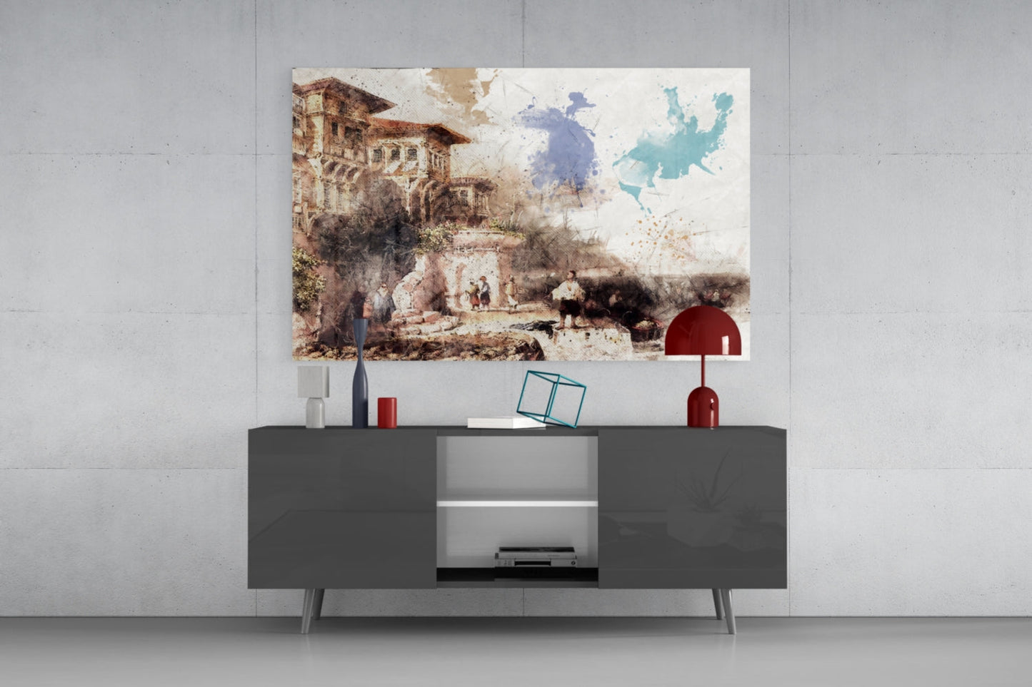 Glass wall art print depicting a sepia-toned castle scene with blue and teal watercolor map above mounted on white wall above dark gray media console.