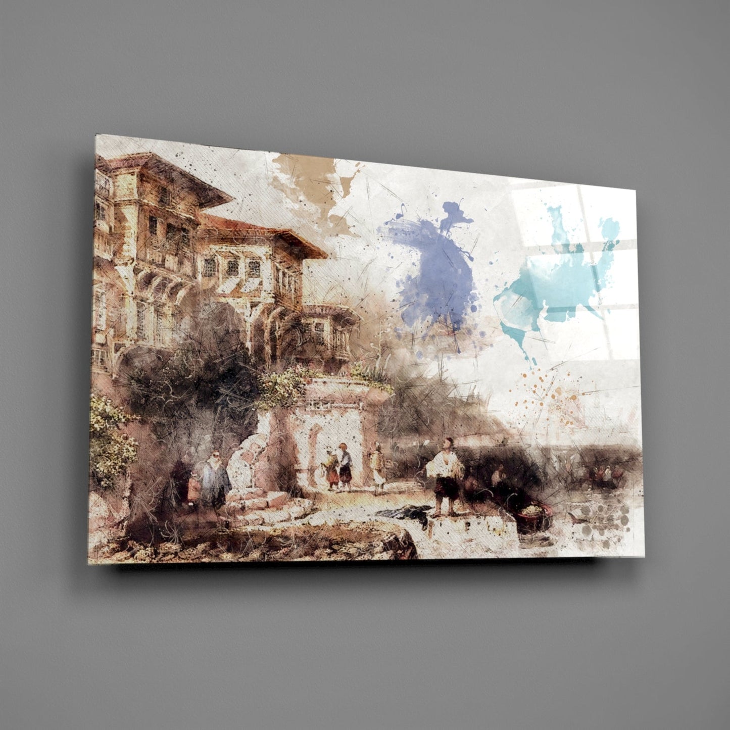 Glass wall art displaying a watercolor-style medieval castle courtyard scene with brown, cream, and turquoise tones, shown at an angle against gray background.