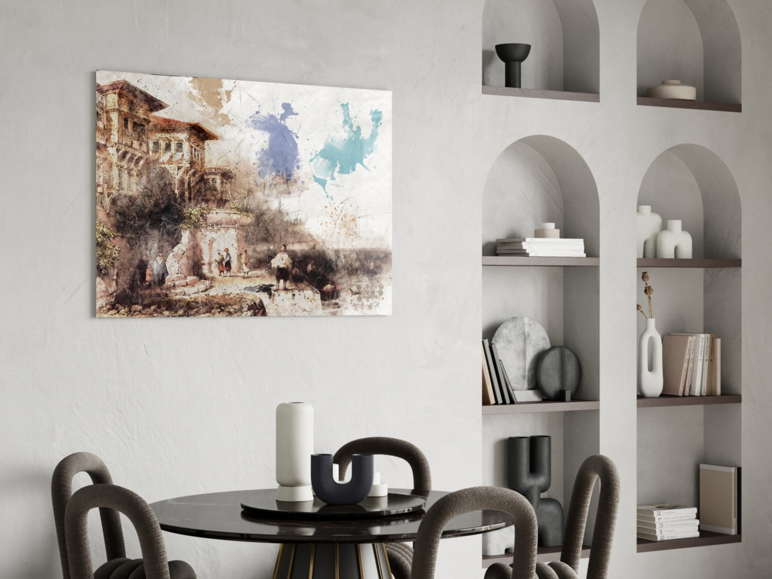 Watercolor architectural artwork featuring a historic building with blue and teal map splashes displayed above a black dining table in a modern interior setting.