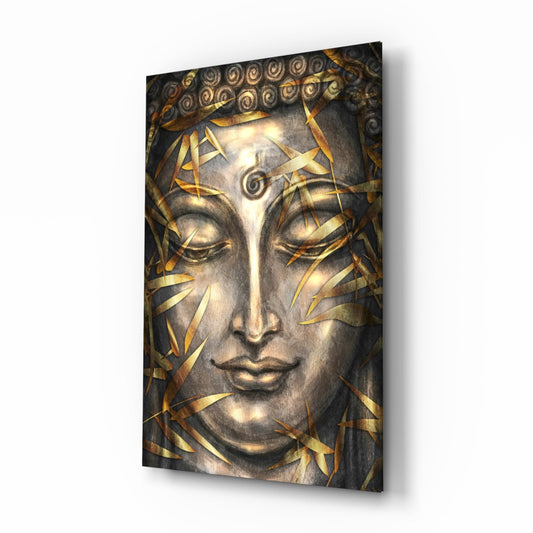 Buddha face sculpture with closed eyes and gold leaf details on dark background, displayed at angle.