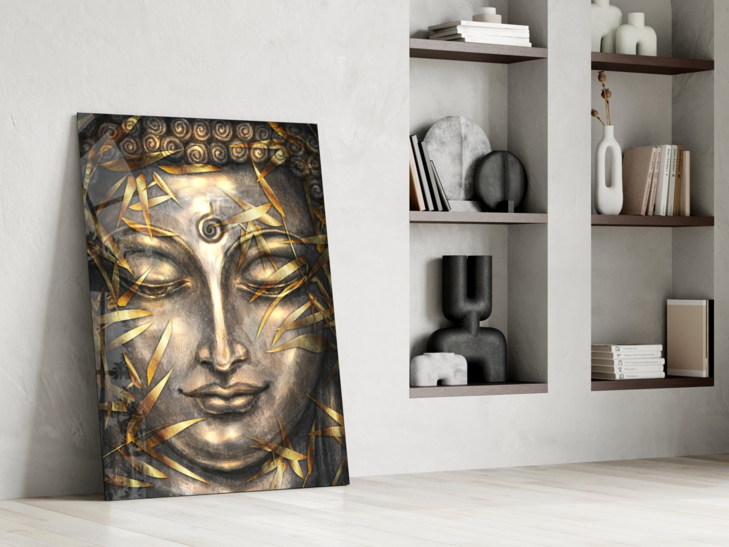 Golden and grey Buddha head canvas art leaning against white wall beside shelving unit with decorative objects and books.