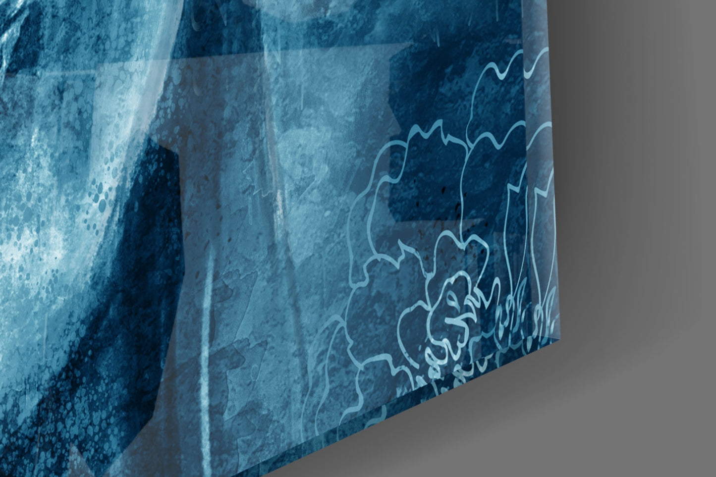 Close-up angled view of blue glass sculpture showing layered wavy white line details etched into deep blue textured surface.