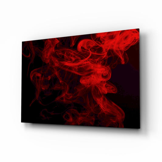 Red and black glass wall art panel displayed at an angle, showing billowing smoke effect with crimson swirls against dark background.