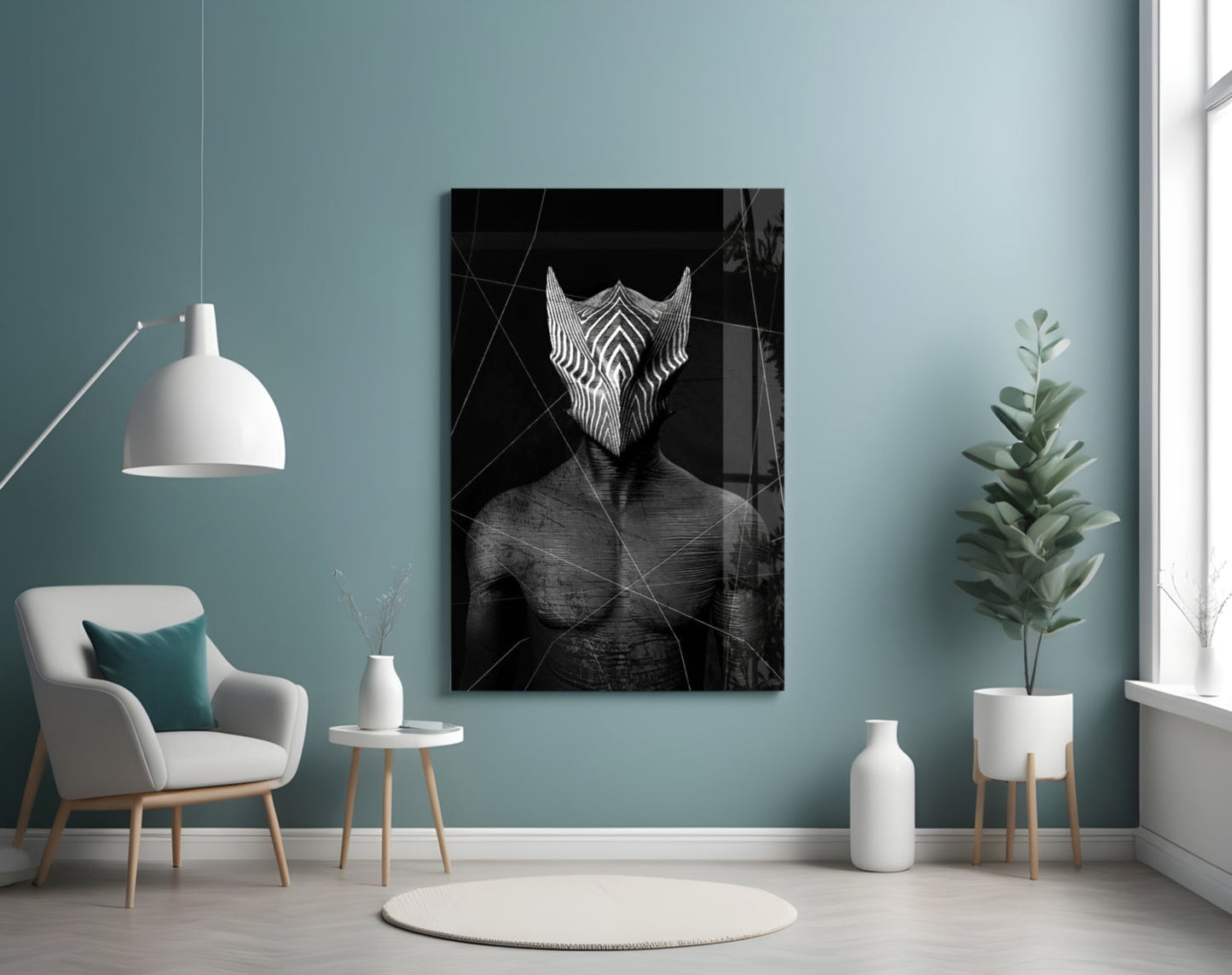 Black and white glass wall art depicting an abstract figure with geometric patterned wings displayed in modern turquoise room setting.