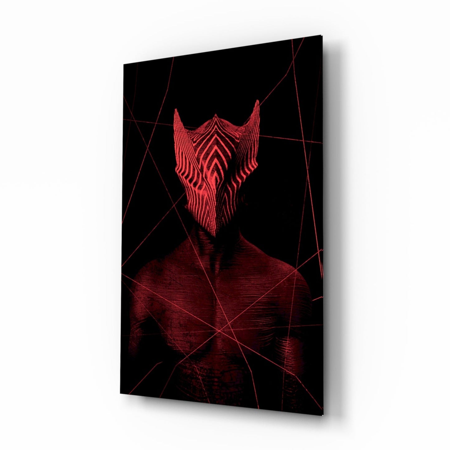 Angled 3/4 view of dark glass wall art with red neon-style geometric face and linear patterns against black background.