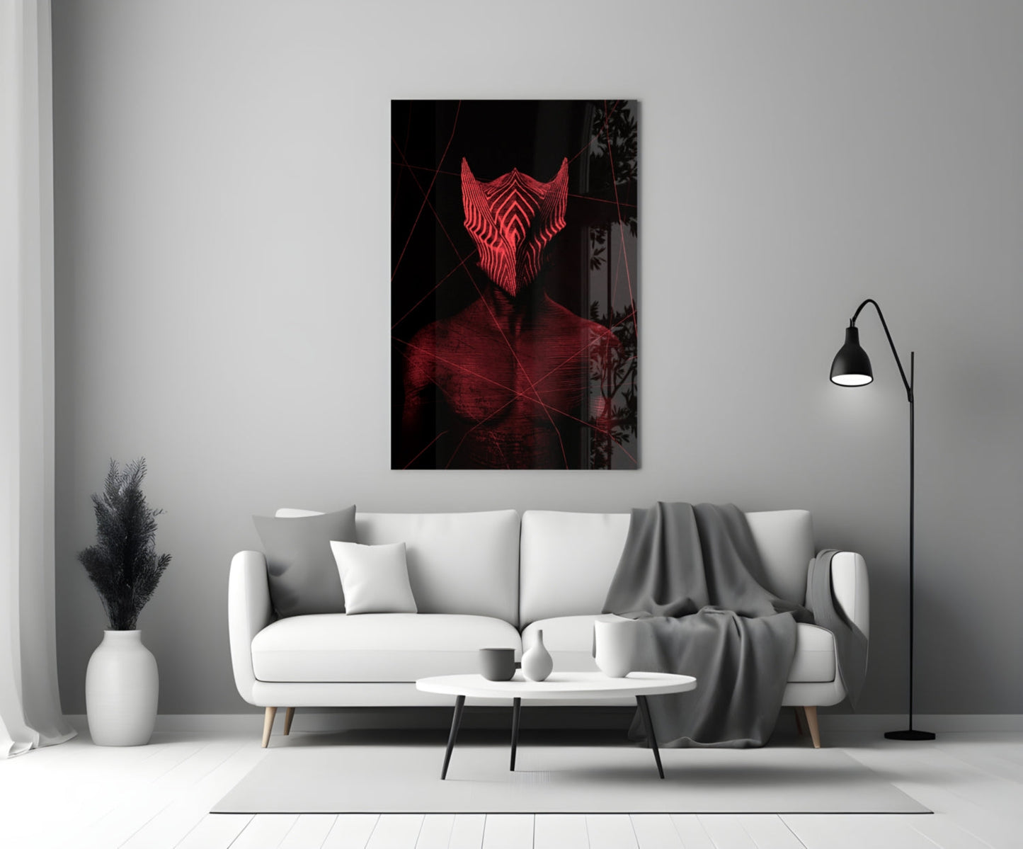 Red neon glowing face artwork hanging above white sofa in minimalist living room setting.