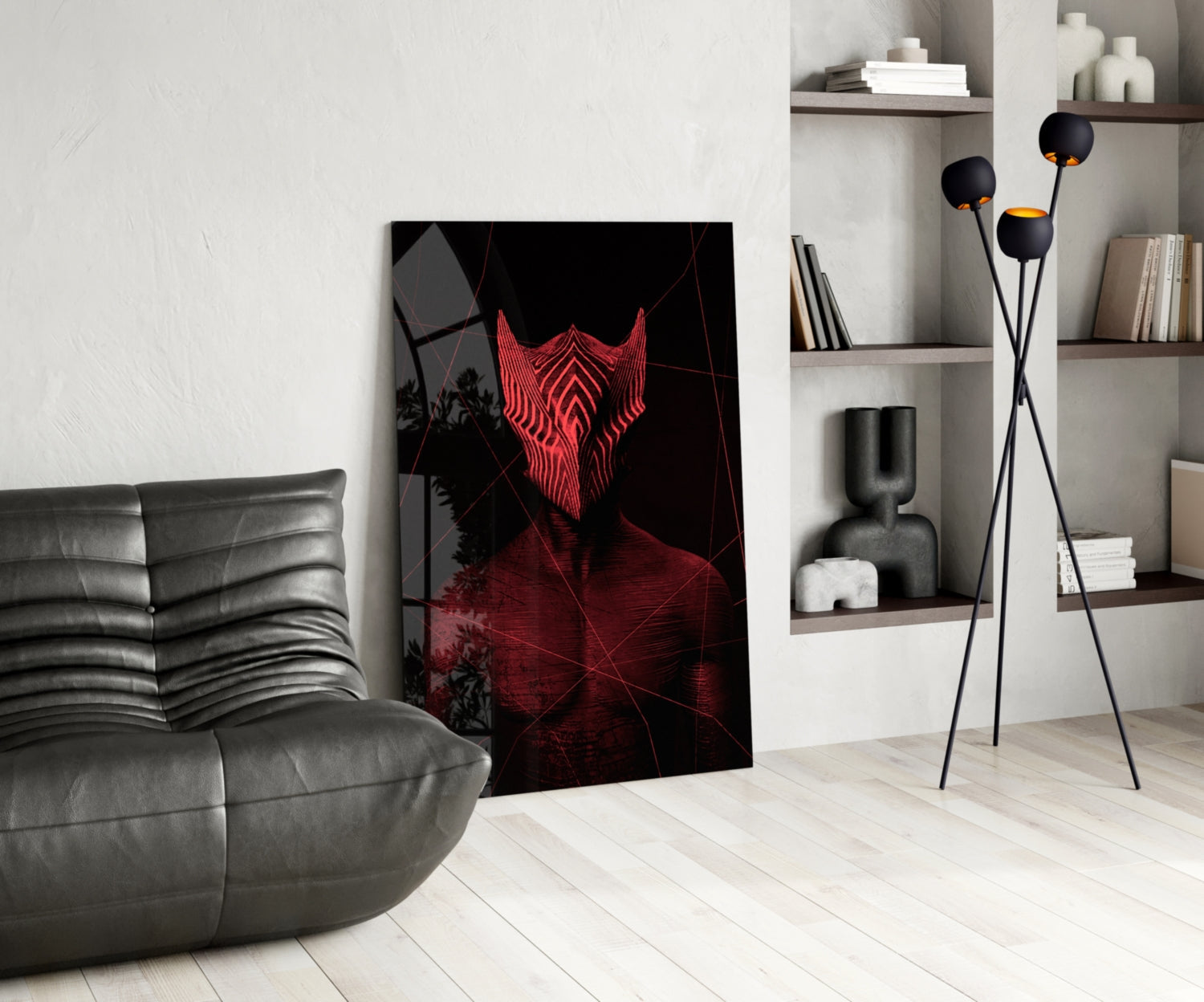 Red neon glowing mask artwork displayed in modern living room with gray leather sofa, shelving, and floor lamp.
