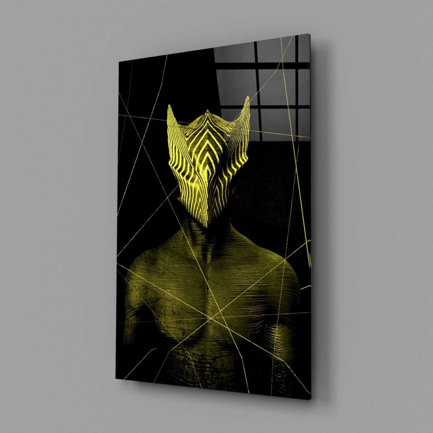 Glass wall art displaying a stylized yellow bearded face on black background with geometric gold line overlay, angled perspective view.