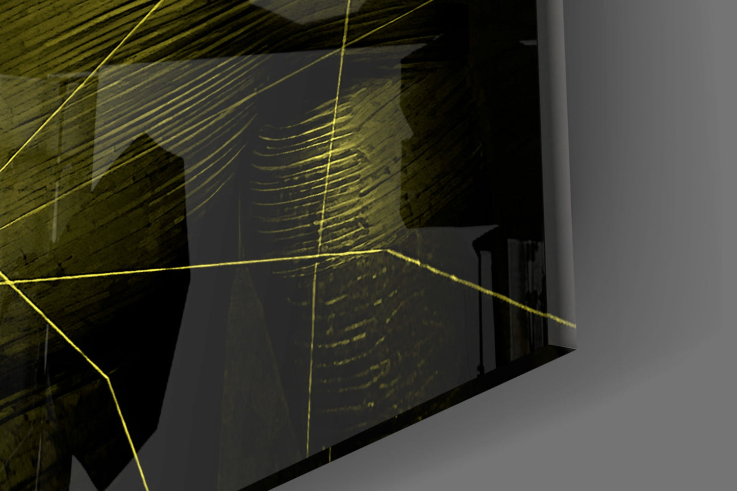 Yellow linear glass art installation mounted on brick wall, angled architectural photograph showing three-dimensional geometric composition with yellow lines against dark interior space.