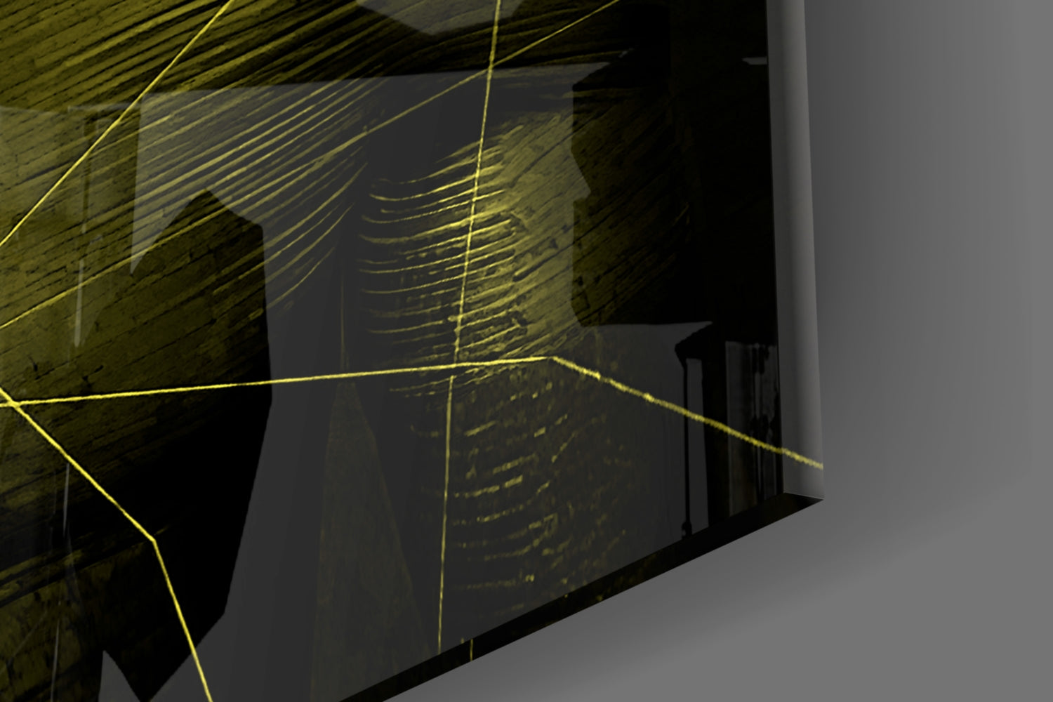 Yellow linear glass art installation mounted on brick wall, angled architectural photograph showing three-dimensional geometric composition with yellow lines against dark interior space.