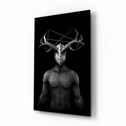 Angled view of black glass wall art featuring a muscular humanoid figure with an elaborate geometric deer skull head and antlers against a dark background.