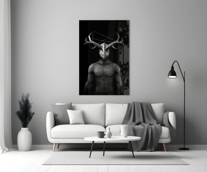 Black and white glass wall art depicting a geometric deer figure with antlers displayed above a white sofa in a modern living room.