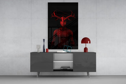 Red neon glass wall art depicting an antlered figure displayed above gray media console in modern interior setting.