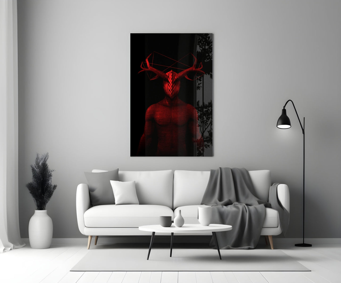 Red glowing neon glass wall art depicting a horned figure displayed above a white sofa in a minimalist living room.