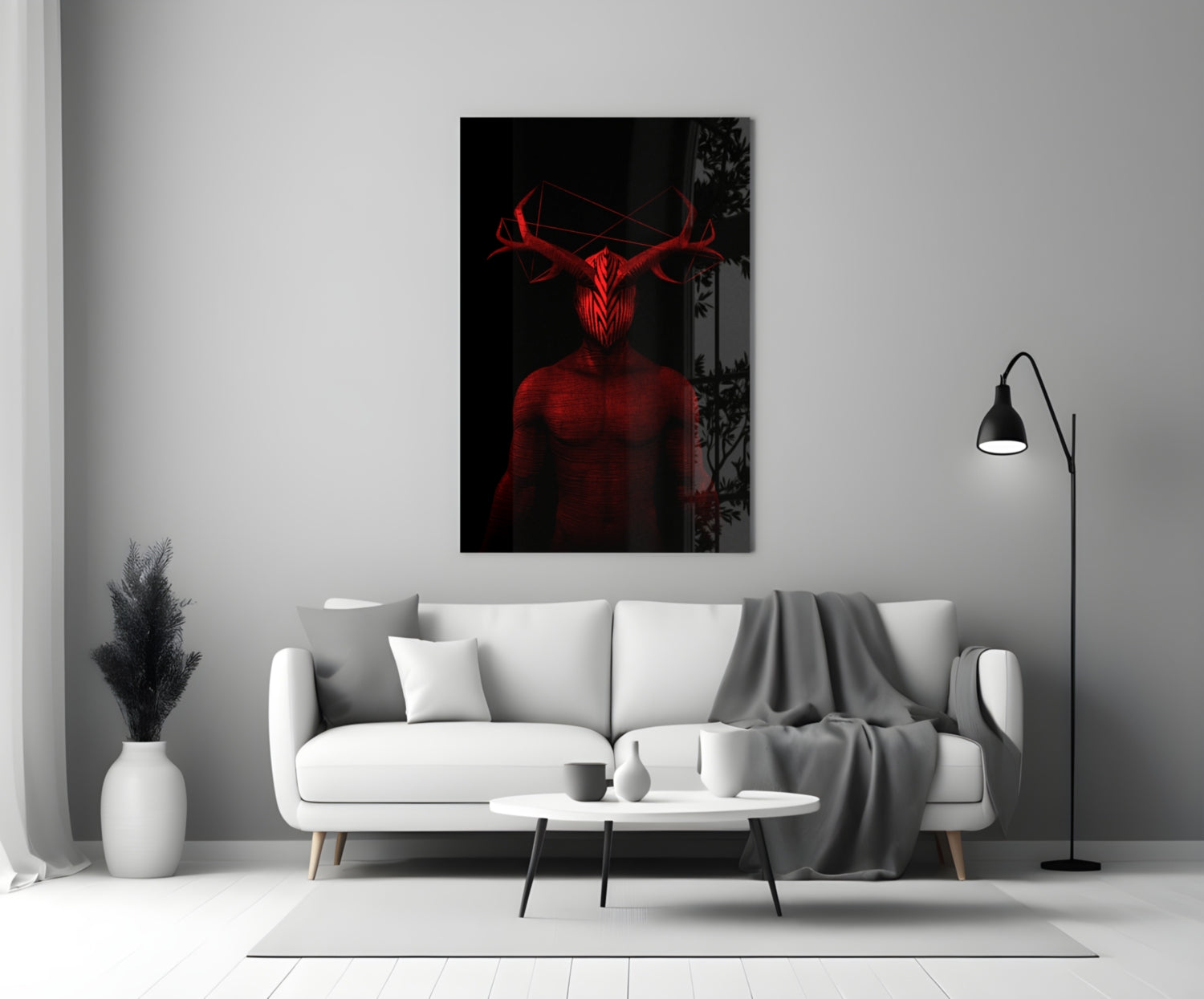 Red glowing neon glass wall art depicting a horned figure displayed above a white sofa in a minimalist living room.