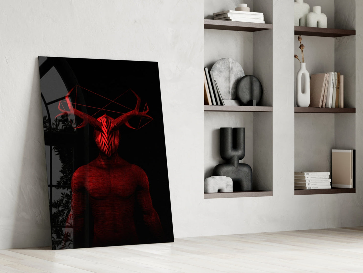 Red and black glass wall art depicting a demonic horned figure leaning against white shelving unit displaying books and decorative objects.