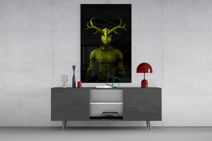 Yellow glowing figure with antlers displayed as wall art above gray media console with red accents and decorative objects.