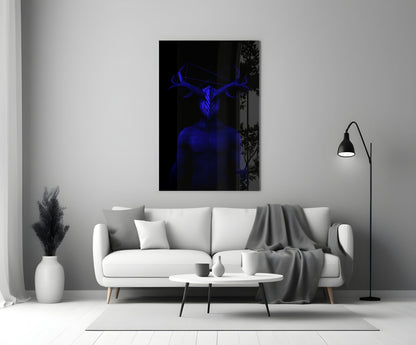 Blue glowing figure with antlers displayed on black glass panel above white sofa in minimalist living room setting.