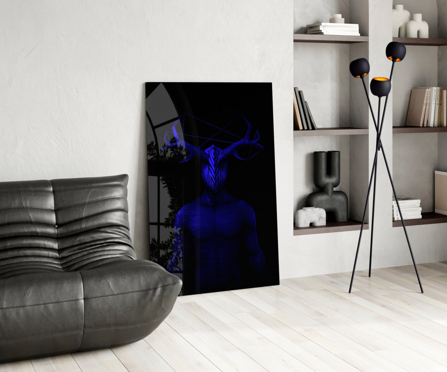 Modern living room interior displaying Donnie Blue Glass Wall Art leaning against white wall, featuring blue neon figure with horns on black background.