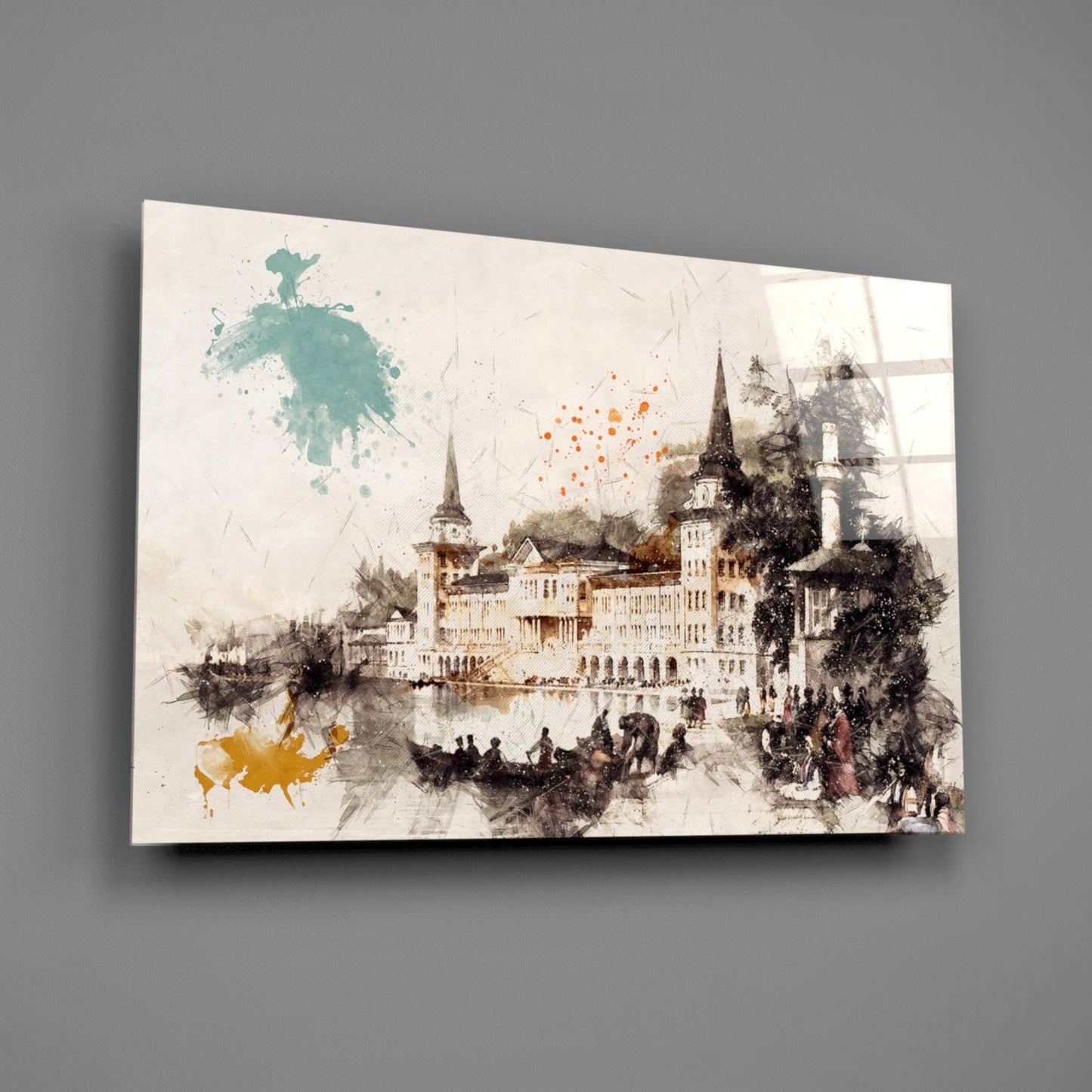 Glass wall art featuring a watercolor castle illustration with teal and orange paint splashes against a cream background, displayed at an angle.
