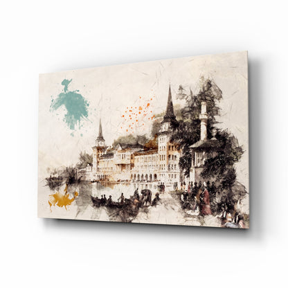 Glass wall art featuring a watercolor castle illustration with turrets, surrounded by splashes of teal, orange, and yellow paint on cream background.