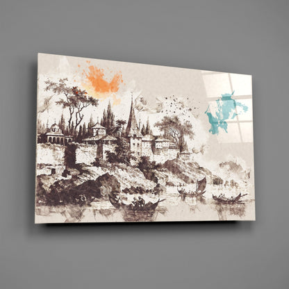 Glass wall art featuring a sepia-toned medieval palace illustration with orange watercolor splash and turquoise map accent, displayed at an angle against gray wall.