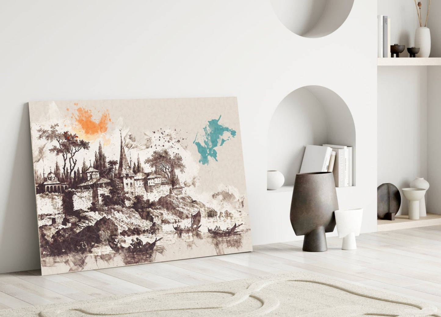 Glass art leaning against white wall displays sepia castle illustration with orange and teal watercolor accents in minimalist interior setting.