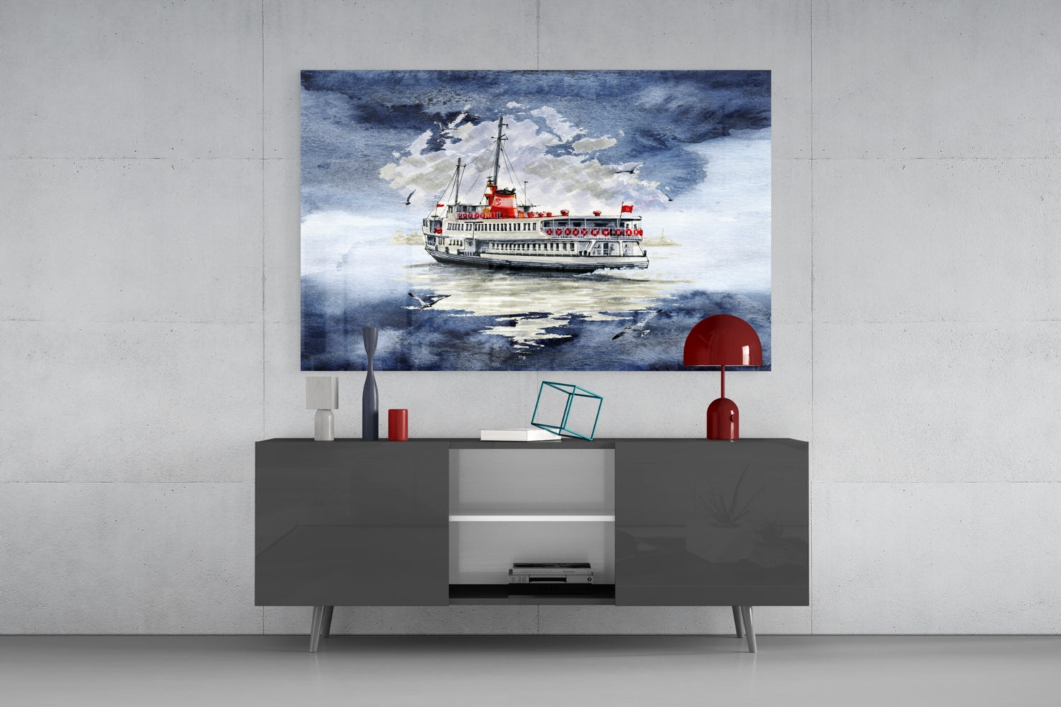 Glass wall art depicting a red and white steamer ship on blue water, displayed above a dark gray cabinet.