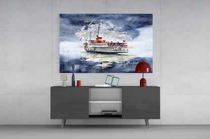 Glass wall art depicting a red and white steamer ship on blue water, displayed above a dark gray cabinet.