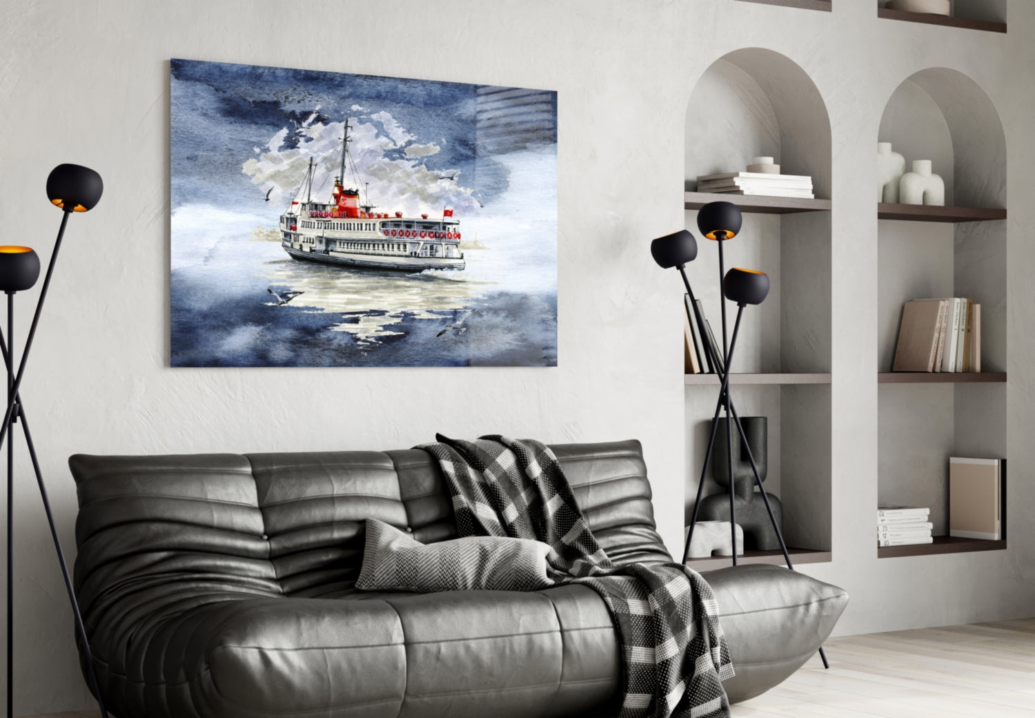 Steamer glass wall art depicting a red and white riverboat on blue water, displayed above a black leather sofa in a modern living room.