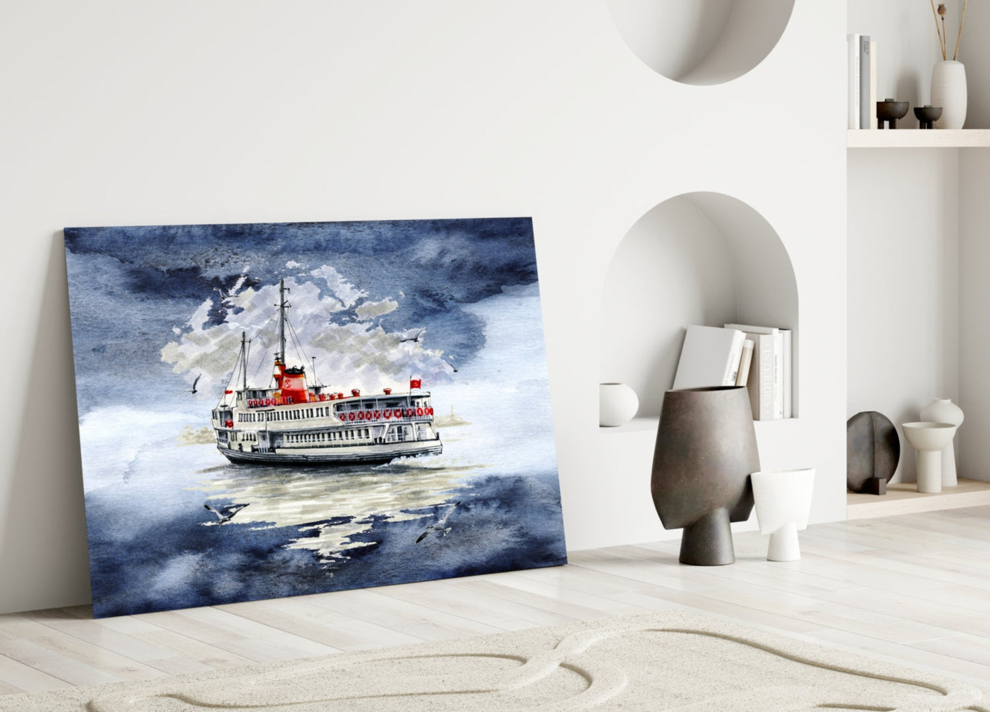 Glass wall art depicting a red and white steamship on blue water displayed leaning against white interior wall with decorative objects.