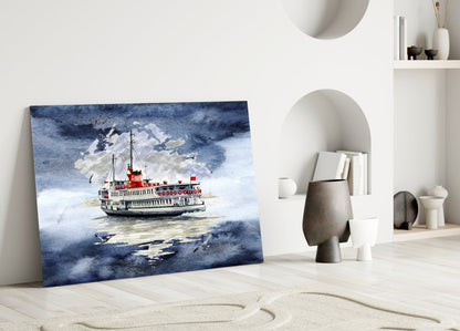 Glass wall art depicting a red and white steamship on blue water displayed leaning against white interior wall with decorative objects.